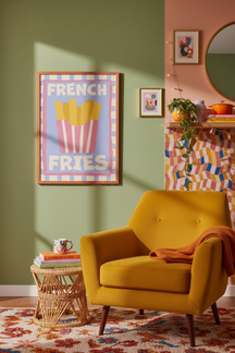 Playful French Fries Art Print shown framed in a modern room setting