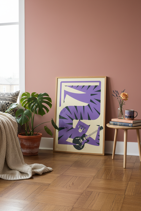 Playful Purple Cat Guitarist Art Print shown framed in a modern room setting