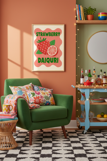Playful Strawberry Daiquiri Art Print shown framed in a modern room setting