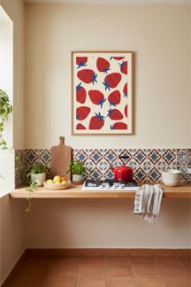 Playful Strawberry Pattern Art Print shown framed in a modern room setting